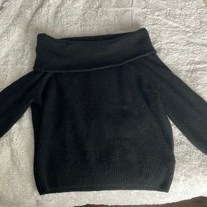 Off the shoulder black sweater.